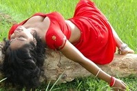 Teertha sexy stills in red saree.