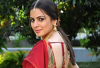 Shraddha Arya in red saree with backless blouse